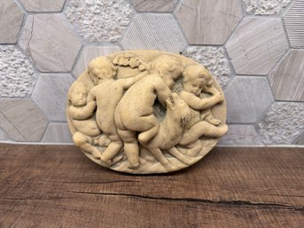 Oval Relief Wall Plaque Featuring Several Cherubs A3