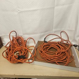 Pair Of Orange Extension Cords