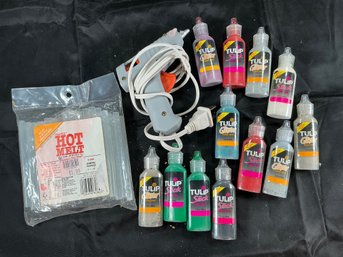 Craft Supplies Bundle Featuring A Hot Glue Gun, Various Tulip Dimensional Fabric Paints, And Clear Glue Sticks