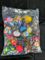 Various Collectible Mini Figures, Including Ryan's World Characters And Tech Deck Dudes