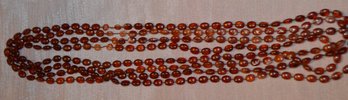 Very Long Strand Of Amber Colored Beads