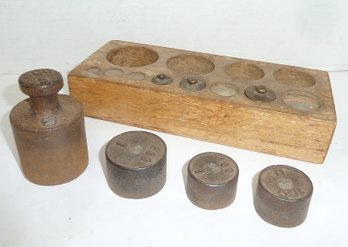 Antique Scale Weights In Wooden Holder
