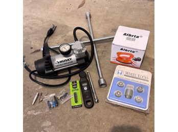 Assorted Car Tools: Tire Iron, Wheel Locks, Husky Volt Inflator, & More (Garage 1)