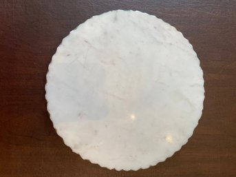 White Serving Plate With A Decorative Scalloped Edge