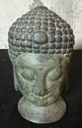 Vintage Cast Stone Buddha Head Sculpture Featuring A Distinct Greenish Patina