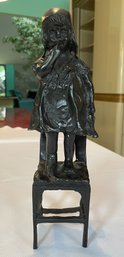Vintage Bronze-Finish Figural Sculpture After Juan Clará Ayats, Depicting A Young Girl Standing On A Chair