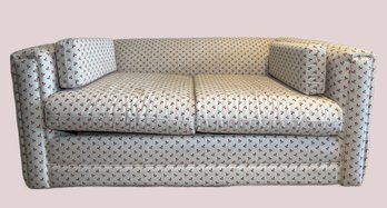 Twin Size Sleeper Sofa In A Red And White Cherry Pattern Fabric