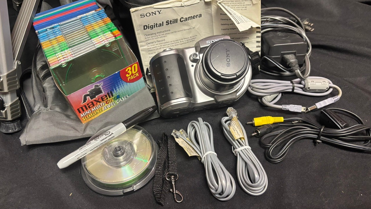 R9 Digital Camera Lot To Include Camera, Recording Discs Tripod, And ...