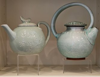 R1 Pair Of Pale Blue-Green Teapots With Display Stands