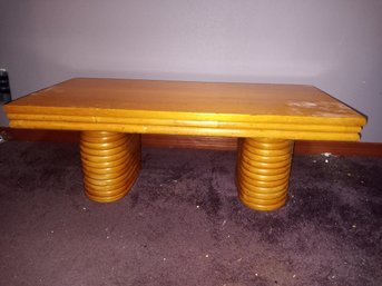 R3 Wood Coffee Table With Decorative Base. Approx. 40'L X 21'W X 15'H. Light Wear.