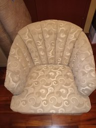 R2 Cream/tan Upholstered Swivel Barrel Chair With Scroll Pattern Fabric.
