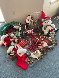 Various Christmas Decorations Including A Snowglobe, Santas, Nativity And Bells