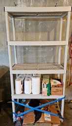 R0 Plastic Shelving Unit With Five Shelves And One Shelf Full Of Items