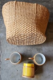 R0 Three Bamboo Cup Holders With Three Cups And A Wicker-like Handbag