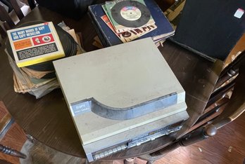 GPX Stereo Turntable And Cassette Players With A Collection Of Records And A Record Carrying Case