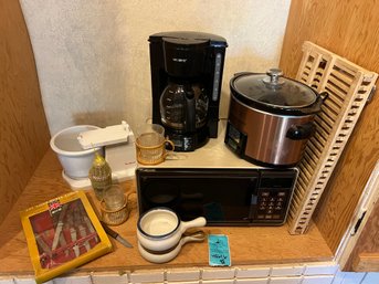 R11 Mixed Storage Lot.  Mr Coffee, Cuisinart Slow Cooker, Packaged Knives, Mixer Pieces, Dishware