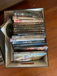 Assorted DVDs, Assorted CDs, 3 Storage Boxes, Toy Koala, Lamp, Clock