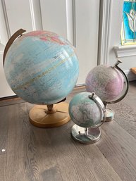 Three Blue And Pink World Globes