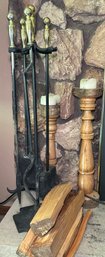 R7 Fireplace Accessories To Include Fireplace Poker, Sweeper, And Shovel, Some Wood, And Two Decorative Candle