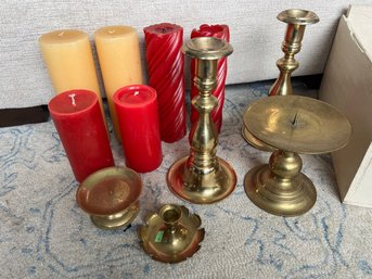 Collection Of Pillar Candles And Brass Candle Stands