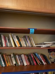 Two Shelves Of Various Books