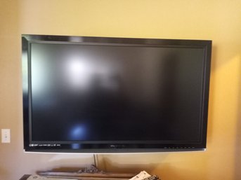 R5 Olevia Flat Screen TV With Wall Mount, Remote, Manuals, And Accessories. Approx. 52W X 34H