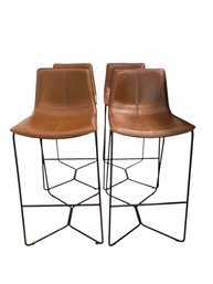 Four West Elm Slope Leather Stools