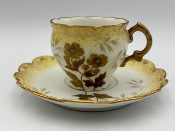 Antigue French Demitasse Teacup And Saucer Limoges Yellow And Tan Heavy Gold Flowers W/ Tiny Blue Centers