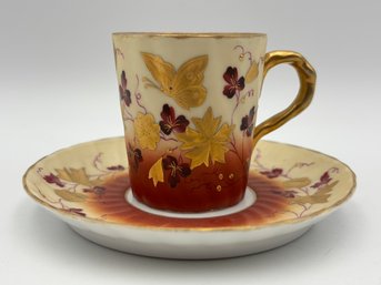 Antique Victoria Carlsbad Austria Demitasse Teacup And Saucer Brownish Red And Cream W/ Gold Decoration