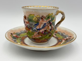 Antique Italian Capodimonte Decorative Demitasse Teacup & Saucer Ornate Depicting Roman Mythology W/ Stand