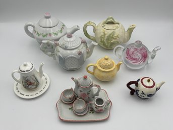 Vintage Collection Of 7 Miniature Tea Pots Ceramic, Plastic, Glass Blown, And 1 Miniature Tea Set