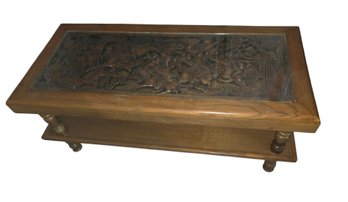 Vintage Asian Hand-carved Wood Coffee Table Featuring An Intricate Figural Relief Scene Beneath A Fitted Glass