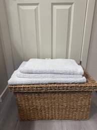 Wicker Basket Holding Bathroom Mats