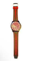 Nanxi-branded Quartz Wristwatch With A Red Dial And A Black And Red Silicone Strap.