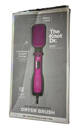 InfinitiPRO By Conair With The Knot Dr. All-in-One Smoothing Dryer Brush In Black And Pink.