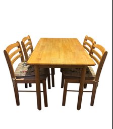This Light Oak Color Solid Dining Table & Chairs.
