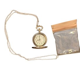 Vintage-style Pocket Watch Featuring A Silver-tone Case With A Gold-colored Steam Train