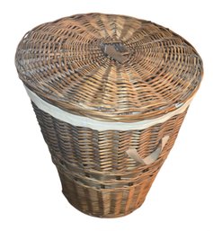 Round, Tapered Wicker Laundry Hamper With A Lid And A Fabric Liner.