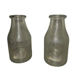 Two Clear, Textured Glass Milk Bottles, Each Marked 'ONE PINT'.
