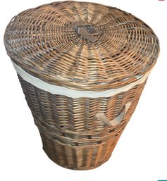 Round, Tapered Wicker Laundry Hamper With A Lid And A Fabric Liner.