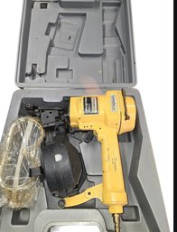 Yellow Bostitch Coil-fed Pneumatic Nail Gun.