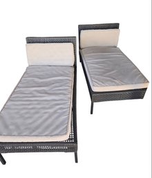 2- Outdoor Chaise Lounge Chairs Featuring A Brown Rattan Wicker Frame And Light-colored Cushions.