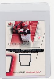 2002 Fleer Genuine Barry Larkin Names Of The Game Game Used Jersey Baseball Card