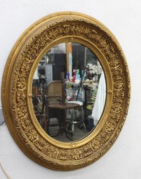Antique Oval Giltwood Mirror With Ornate Floral Frame  Minor Crack In Gilding
