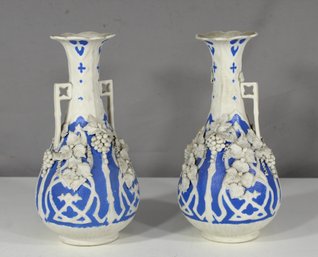Pair Of Decorative Blue And White Porcelain Vases With Raised Floral Motif