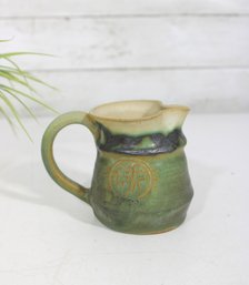 Signed Studio Pottery Creamer Pitcher Green Glaze W/ Applied Medallion  4'