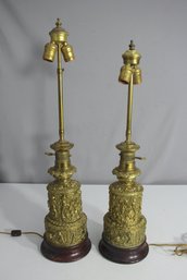 Pair Of Ornate Brass Table Lamps With Relief Detail And Wooden Bases