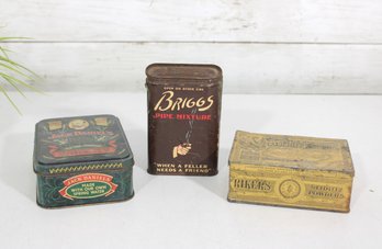 Lot Of 3 Vintage Advertising Tins  Jack Daniels Whiskey, Briggs Pipe Mixture & Raeburns Drugs Tin Boxes