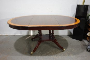 Vintage Mahogany Oval Pedestal Dining Table With Inlay And Brass Casters