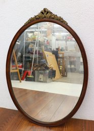 Stately Rose Bow Crest Walnut Oval Wall Mirror